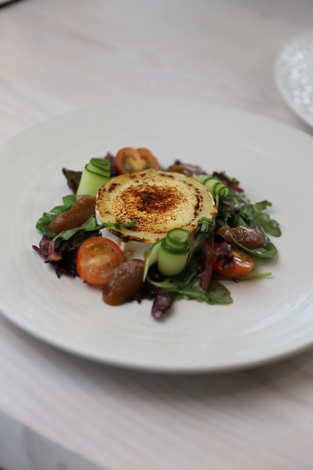 Grilled goat’s cheese salad with poached pear